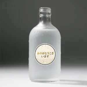 Close-up of gold-stamped Japanese thank you sticker with traditional wave pattern