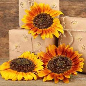 Detailed view showing gold foil heart honeycomb stickers on rustic brown gift packaging