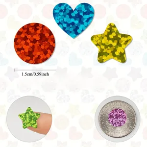 Close-up of 1.5cm holographic laser stickers showing circular, heart and star shapes.