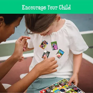 Close-up detail of a child wearing various motivational animal stickers on a white shirt