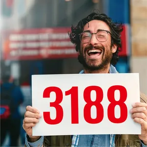 Large red 3188 vinyl waterproof number stickers for mailbox on white board held by a person