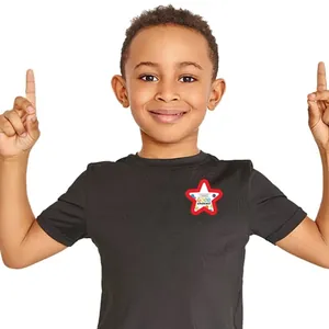Detail of star-shaped motivational sticker I Make Good Choices on child's t-shirt