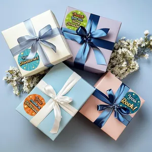Inspirational round reward stickers shown on various colorful gift boxes with ribbons