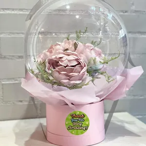 Close-up of colorful 'Thank You For Being Amazing' sticker used on a pink floral gift box