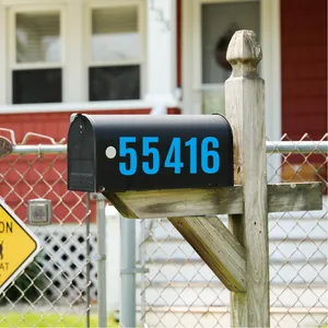 Large blue vinyl number stickers applied to a black outdoor mailbox for identification
