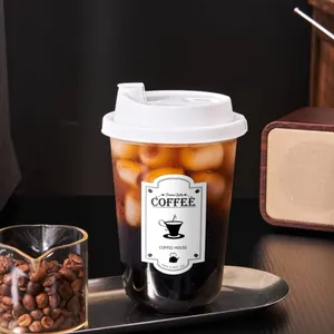 Close-up of a rectangular black and white decorative sticker on an iced coffee cup