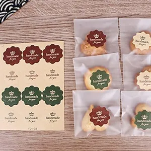 Close-up view of vintage style handmade for you stickers on small cookie gift bags