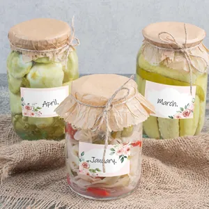 Floral sticker labels with rose designs on glass preserve jars with rustic twine detail