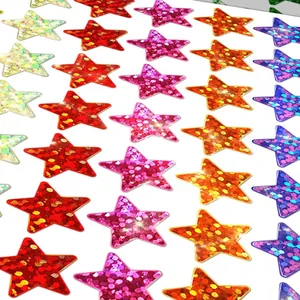Detail view showing a variety of colorful holographic laser star stickers on a sheet.