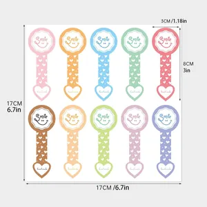 Detailed size diagram of colorful smile long-strip stickers for cake box sealing.