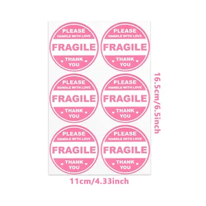 Detail view showing dimensions of pink fragile stickers for shipping and handling