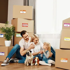 Happy family surrounded by boxes with color-coded 3.5x2 inch moving labels