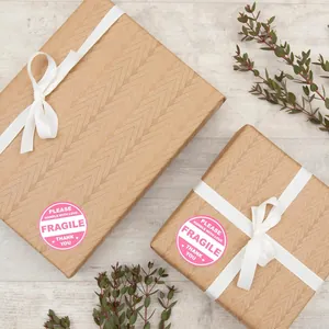 Pink round Fragile warning labels with Please Handle With Love text on gift boxes