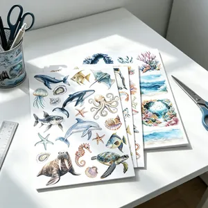 Detailed view of watercolor marine life stickers featuring whales and sea turtles for DIY