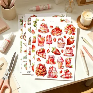 Macro view of strawberry dessert watercolor stickers for creative DIY scrapbooking