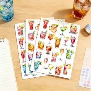 Close-up view of watercolor summer drink and cocktail stickers for creative journaling and DIY