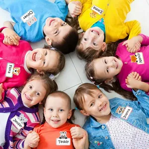 Personalized animal name stickers for children shown on colorful clothing in a circle group