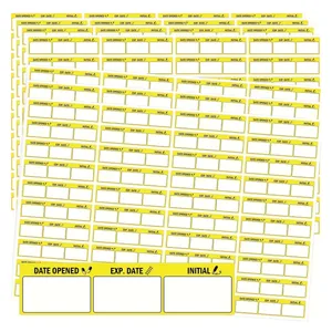 Detail view of yellow self-adhesive labels for recording opening and expiration dates