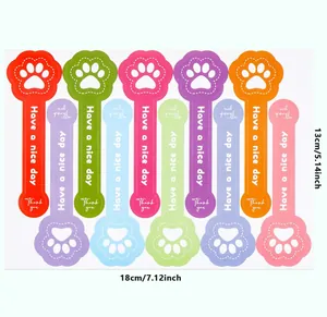 Detailed size view of colorful paw-shaped stickers for gift packaging decoration