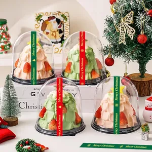 Close-up view of red and green Merry Christmas sealing stickers on clear baking container domes