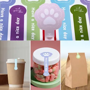 Detailed view of cute dog paw sealing stickers applied to coffee cups and jars