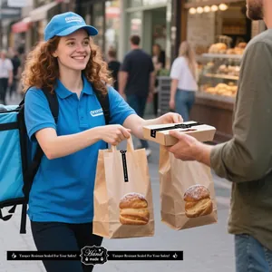 Black handmade bakery sealing stickers on pastry bags for professional food delivery.