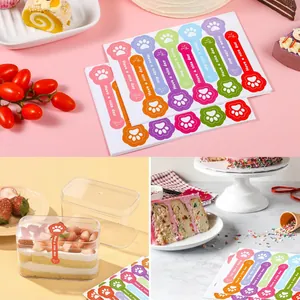 Close-up detail of cute dog paw 'Have a nice day' stickers used for bakery gift packaging