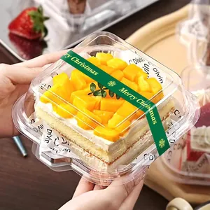 Hands holding a transparent plastic cake container with green Merry Christmas seal sticker