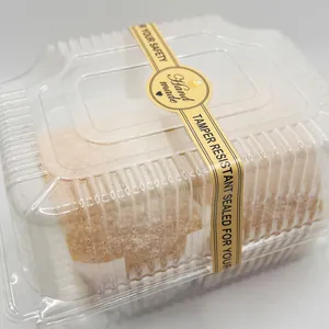 Lungo adesivo da forno marrone con scritta "Hand made" su una scatola di dolci.