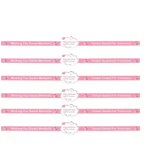 Tabla de tallas detallada para pegatinas de sellado de regalos de repostería rosa.