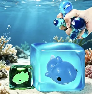 Detail showing the soft texture of luminous blue and green ocean animal squishy toys