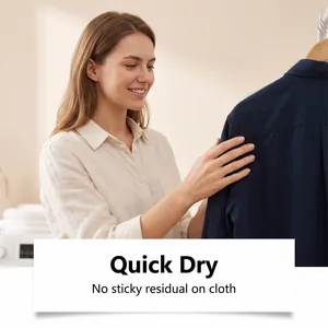 Detail of clothing care spray effect showing quick dry and no sticky residue on blue shirt.