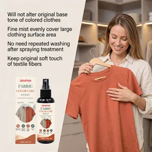 A woman showing a vibrant orange shirt restored by Jakehoe fabric color care spray