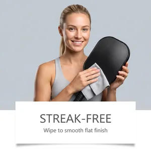 Professional pickleball racquet cleaner detail showing streak-free wiping effect on black surface
