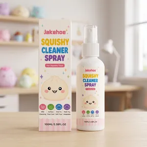 Jakehoe Squishy Cleaner Spray bottle and box packaging shown on a wooden table desk