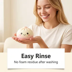 Close-up of a cute steamed bun squishy toy highlighting its easy rinse and clean feature