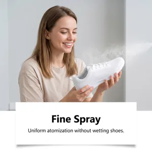Macro view of a fine spray mist being applied to a white sneaker for odor removal.