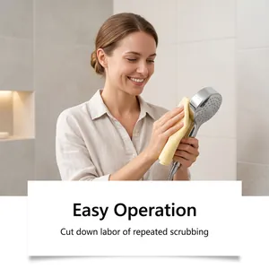 Detail showing woman cleaning a chrome showerhead with cloth for effortless maintenance