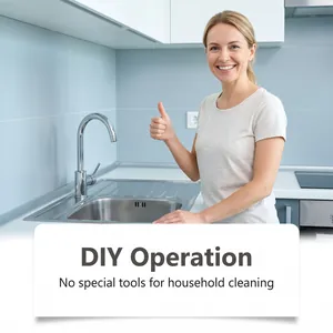 Smiling woman in kitchen demonstrating easy DIY pipe cleaning operation without tools.