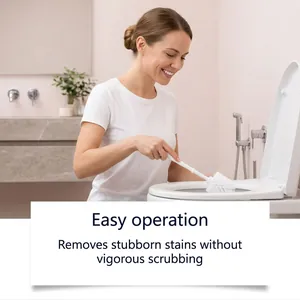 Woman cleaning toilet with a white brush in a bright modern bathroom setting
