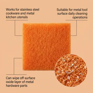 Macro detail view of orange rust removal scouring pad showing abrasive cleaning particles.