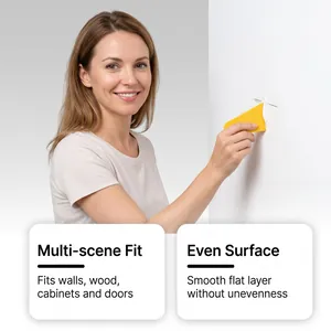 Woman using a yellow scraper with white wall repair paste to fix surface cracks effectively