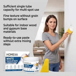 White touch-up paste application on a wall crack with included yellow scraper tool