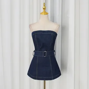 Elegant dark blue denim strapless top featuring a waist belt and contrast stitching