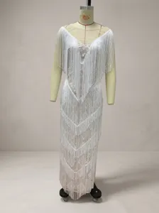 Detailed front view of elegant white sleeveless V-neck fringe dress on mannequin