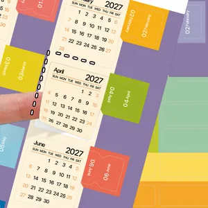Primer plano de pegatinas de calendario mensual 2027 con pestañas de colores