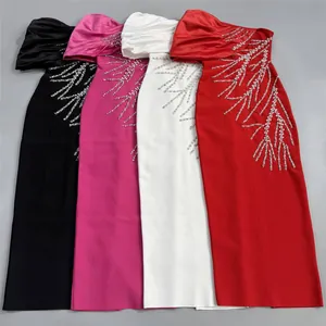 Detail showing intricate rhinestone patterns on four different colored bandage dresses