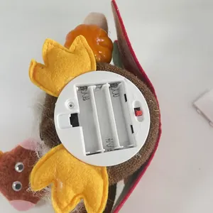 Close-up detail of the battery compartment on the glowing Harvest Festival turkey decoration