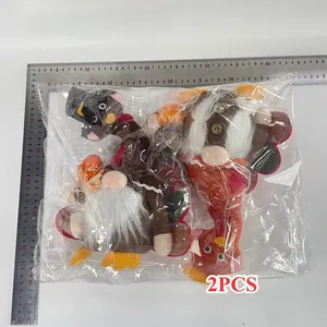 Detail view of 2pcs Thanksgiving turkey gnome plush ornaments with size measurement ruler.