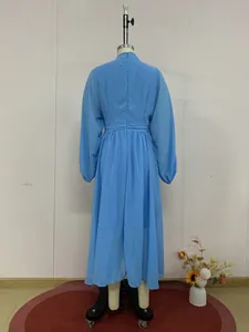 Back view of a blue mesh long sleeve elegant dress shown on a display mannequin